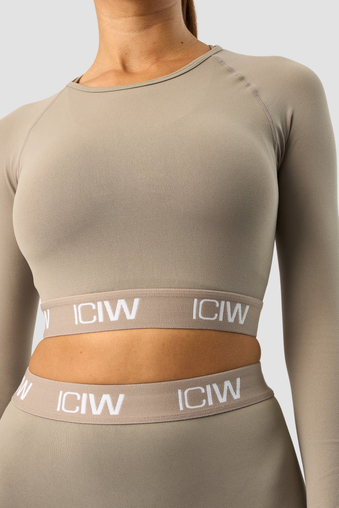 define seamless logo long sleeve crop top taupe